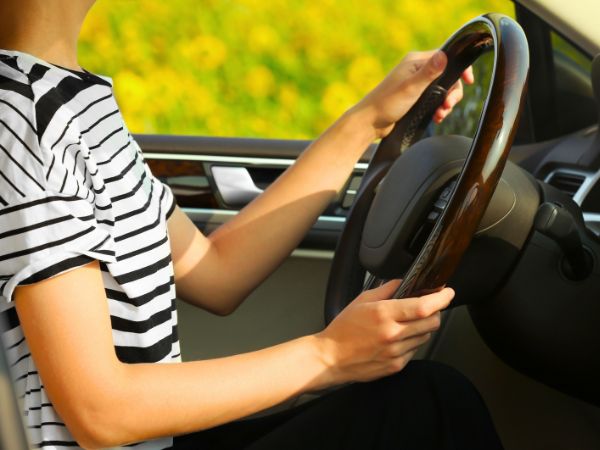 Woman driving in a rental car
